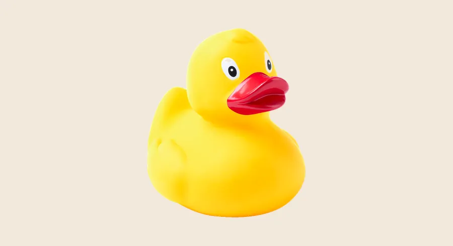 Juguetes personalizados: pato de goma amarillo con pico rojo