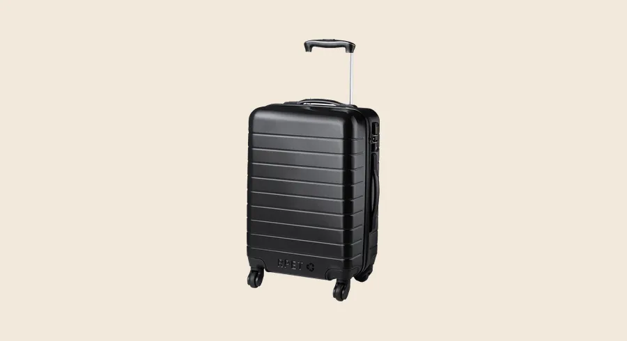 Merchandising para agencias de viajes: trolley de cabina negro con ruedas giratorias y cierre TSA