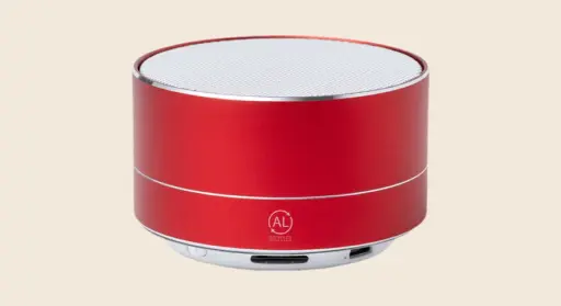 Merchandising tecnológico: altavoz bluetooth rojo cilíndrico