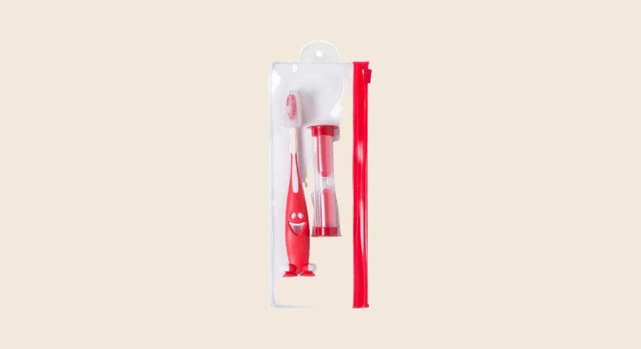 Regalos para niños en la clínica dental: cepillo infantil con reloj de arena en estuche transparente