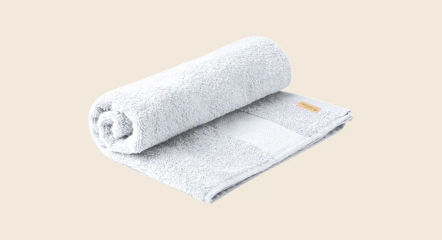 Toallas para hoteles personalizadas: toalla blanca de algodón orgánico enrollada